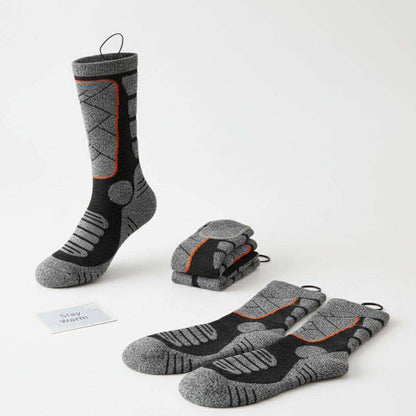 Heated socks with 4000mAh battery, washable, breathable fabric, and adjustable heat settings for winter warmth